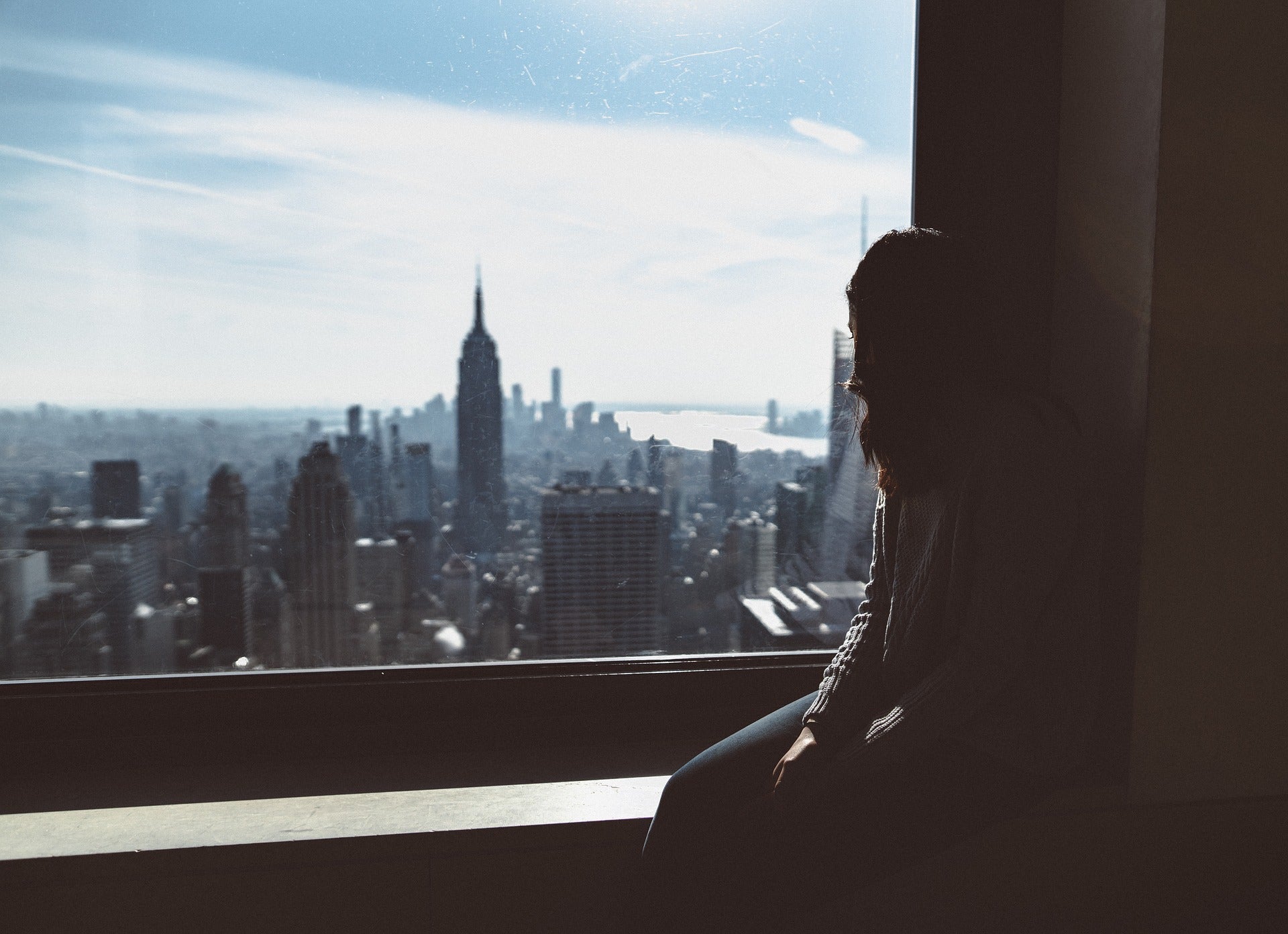 A future society could eliminate the privacy this woman has as she looks over the city.