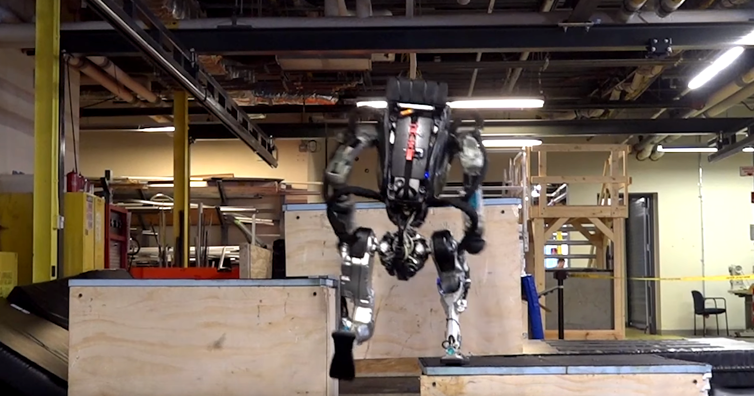 In a newly released video, you can watch Boston Dynamics's humanoid robot Atlas parkour its way across a makeshift obstacle course.