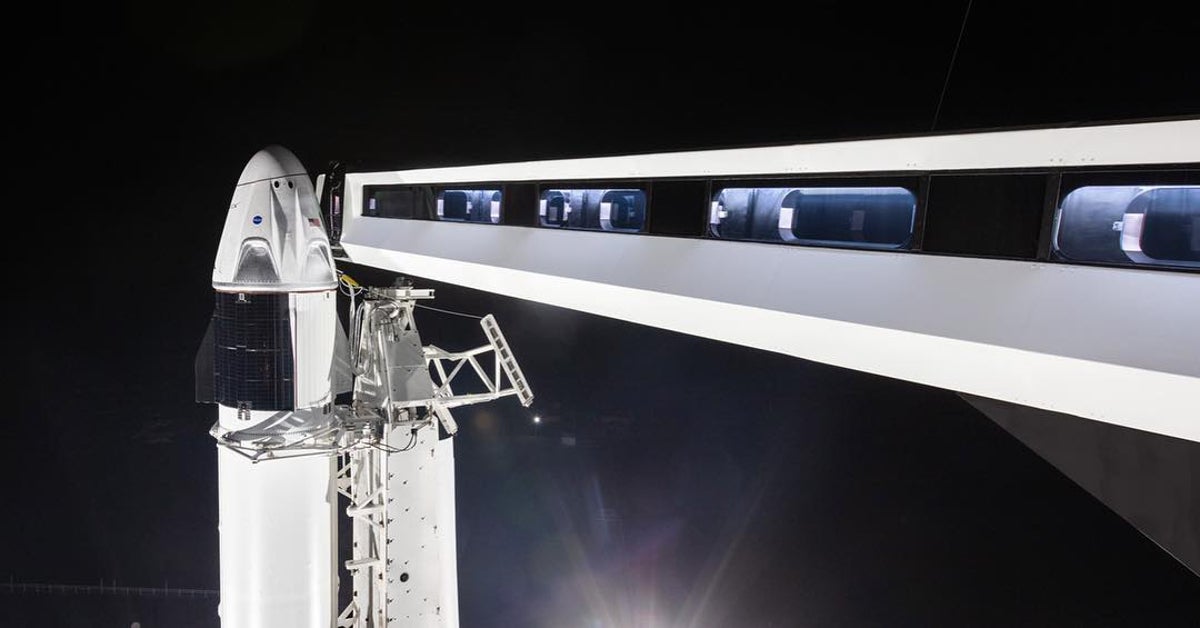 A SpaceX Crew Dragon space craft sits atop a Falcon 9 rocket