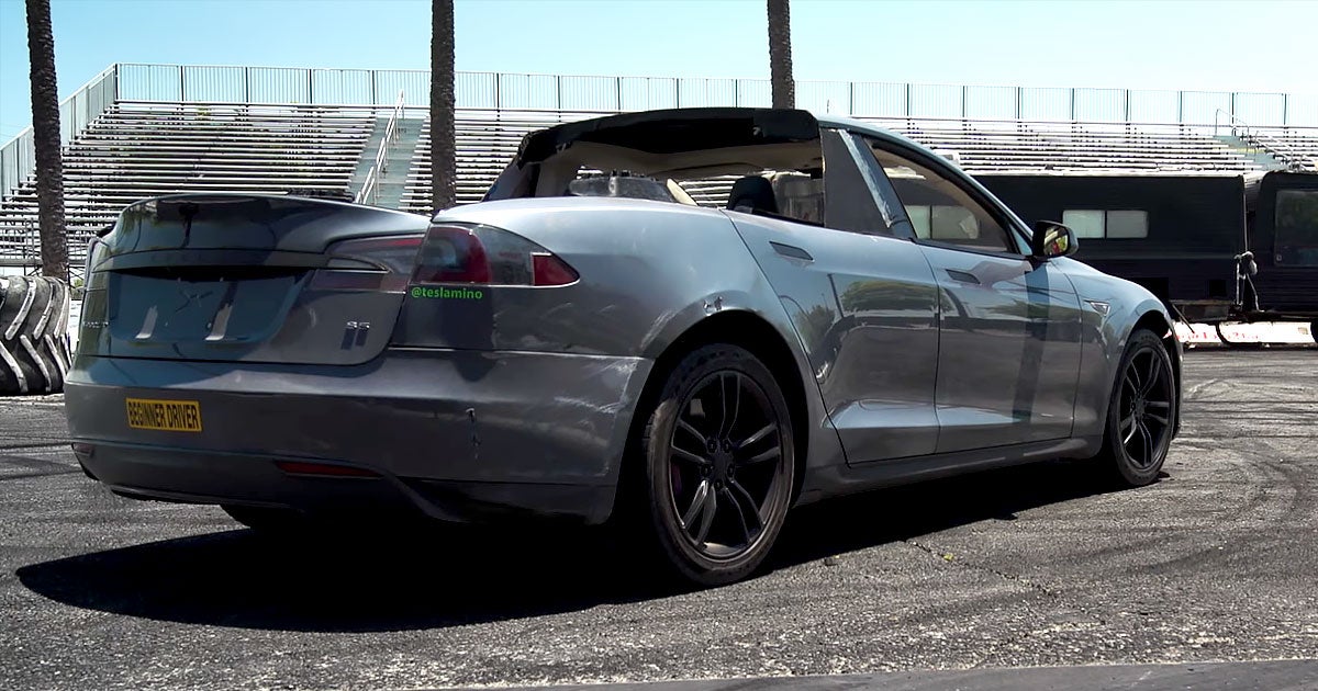 To carry their dirt bikes into the desert, an electric car conversion company chopped off the back of a damaged Tesla Model S to turn it into a pickup.