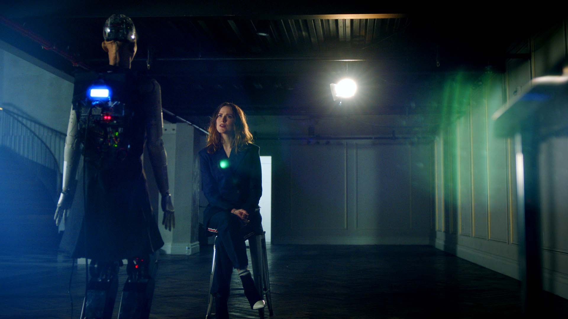 Sophia the Robot and Evan Rachel Wood sit in dramatic lighting
