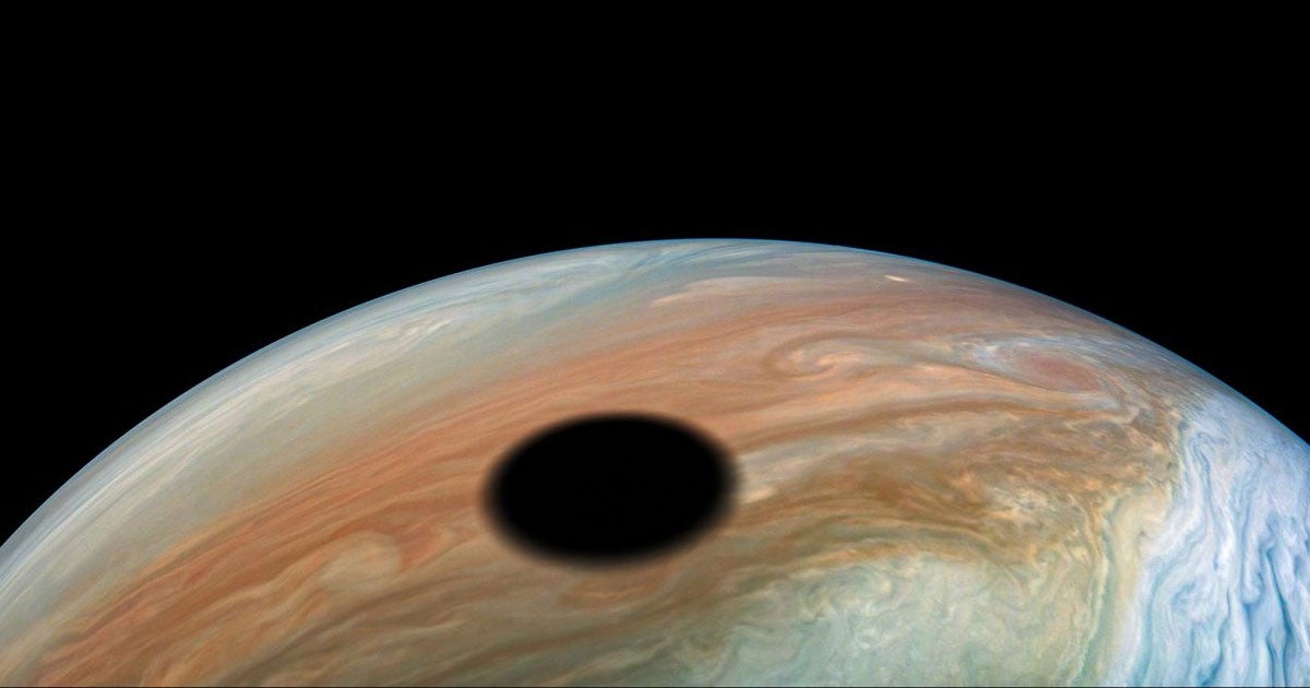While performing a close flyby of Jupiter, NASA's Juno spacecraft captured several stunning images of a solar eclipse on the gas giant.
