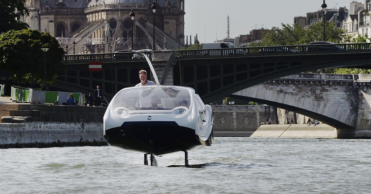 A "flying" taxi that uses hydrofoils to hover above the water was detained during a test in Paris because police didn't know it had permission to speed.