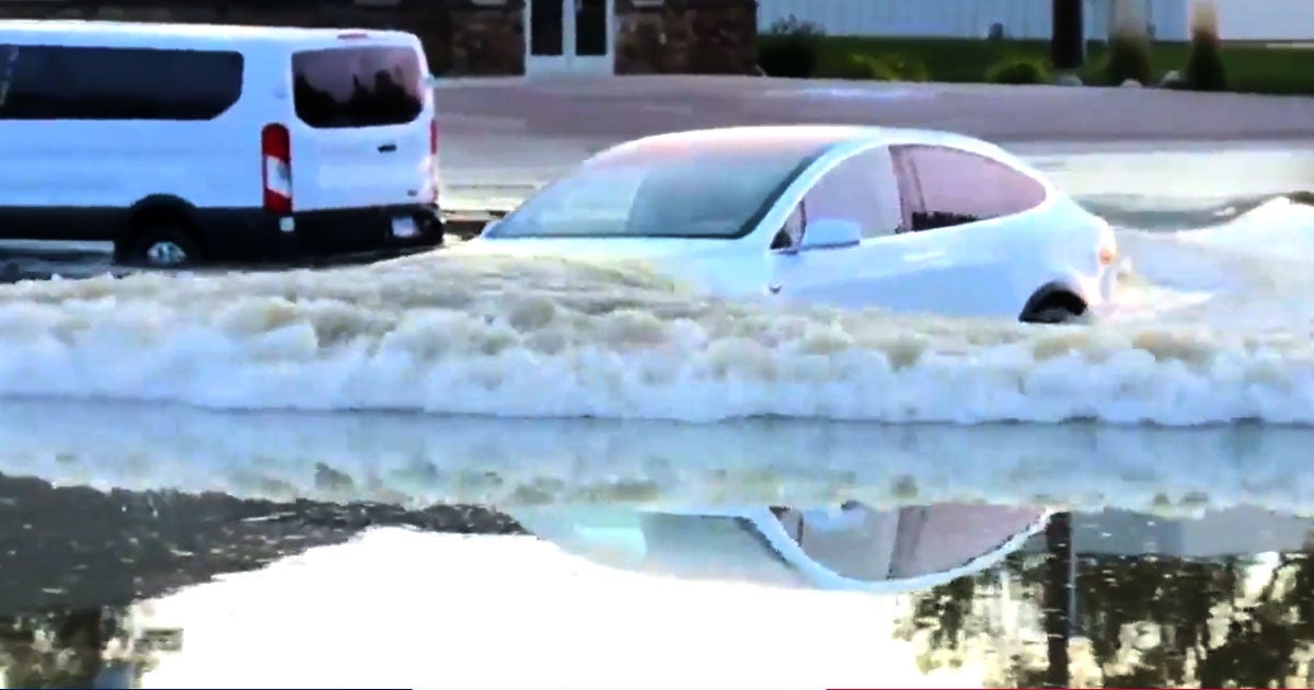 A news reporter caught a Tesla Model X plowing its way down a flooded street in South Dakota, exiting the water seemingly no worse for wear.