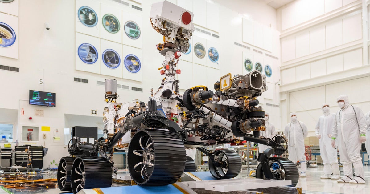 NASA's Mars 2020 rover rolled forward and backward for the first time inside a clean room at NASA's Jet Propulsion Lab, clearing small ramps.