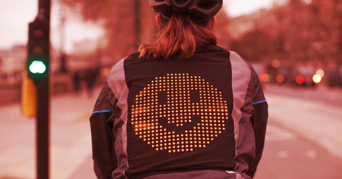 Ford has created a jacket for bicyclists that allows them to communicate with drivers using emoji displayed in LEDs on the rider's back.