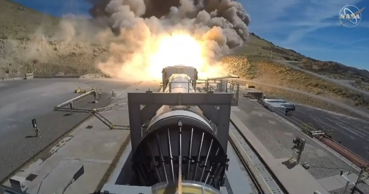Northrop Grumman just ignited a booster for NASA's long-awaited Space Launch System (SLS). The ensuing fireball was so huge, it lit a nearby hill on fire.