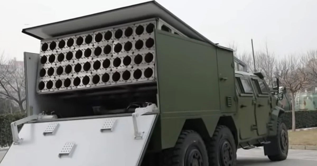 China has released a video of a test involving an array of 48 weaponized drones launching from the back of a truck and from a helicopter.