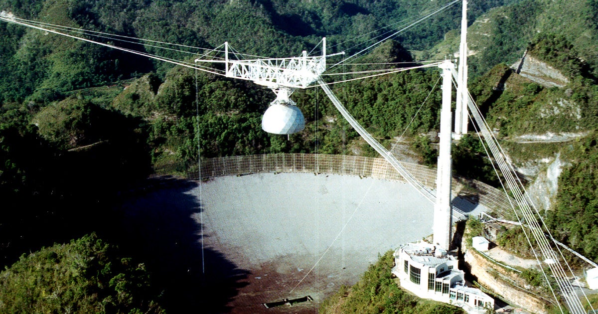 The massive alien hunting radio telescope at the Aericbo Observatory is at risk of collapse after several support cables failed leaving extensive damage.