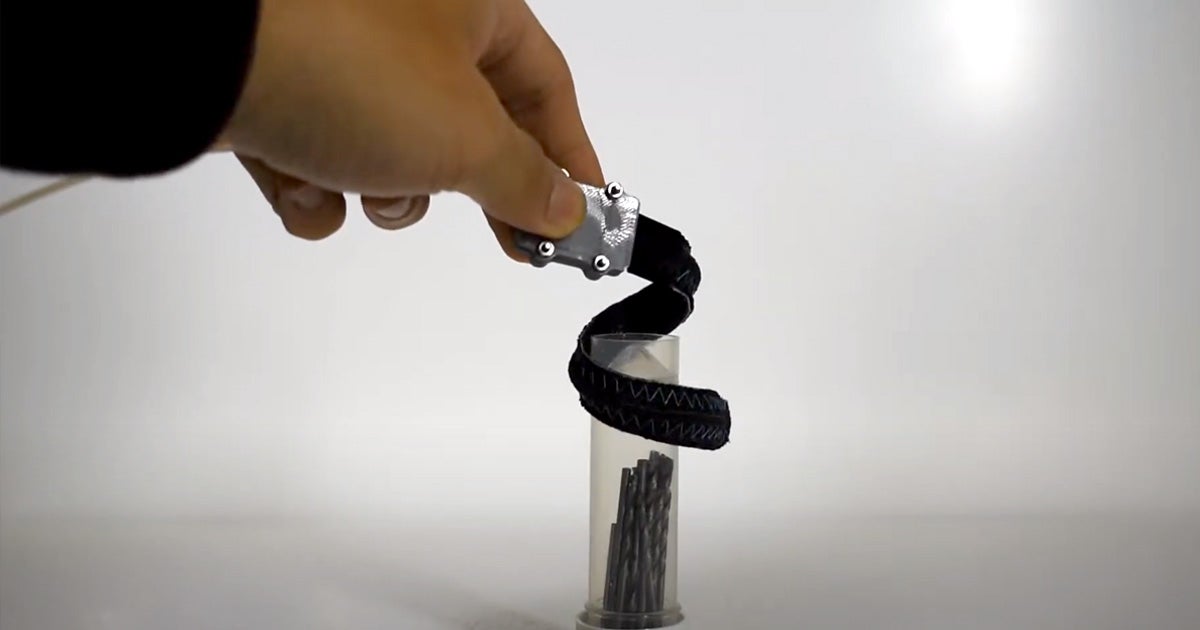 A new robotic arm wraps around and grabs onto objects like a snake or a robot's trunk, allowing it to safely handle delicate objects.