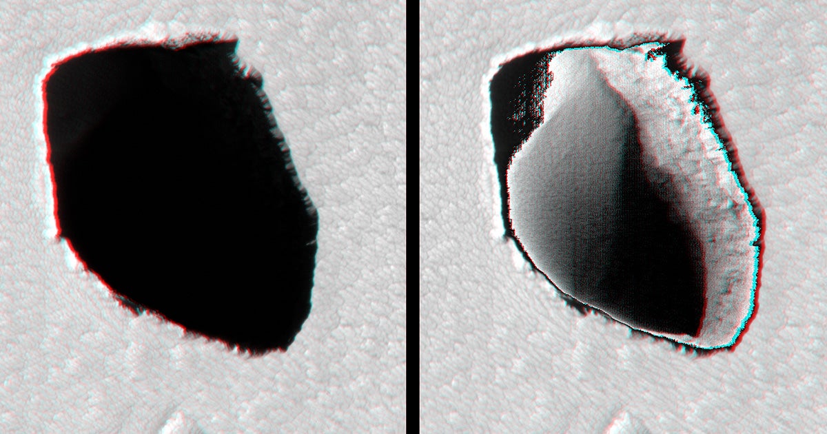 NASA's Mars Reconnaissance Orbiter spotted something rather strange on the Martian surface below: a deep pit, appearing in the form of a black spot.