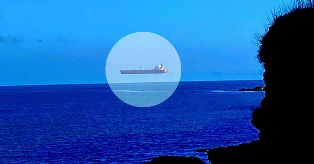 A bizarre photograph of a ship seemingly hovering above the sea off the coast of Cornwall, UK, made its rounds late Thursday.