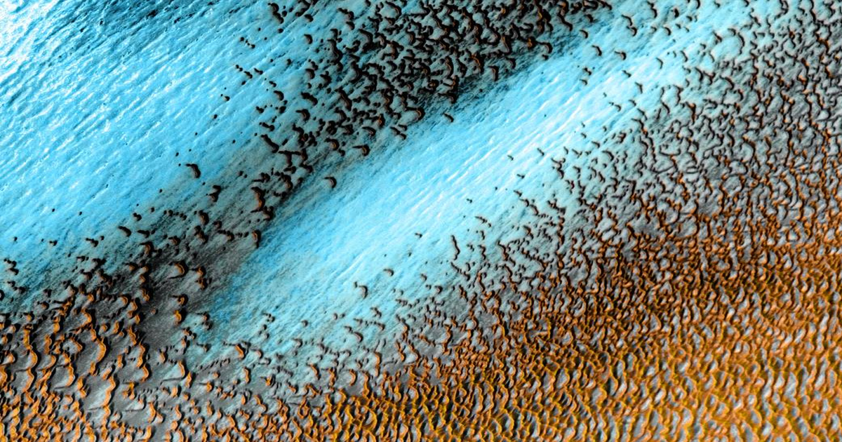 NASA released a stunning new photo of Mars on Thursday depicting a series of bright-blue dunes near the Red Planet’s polar cap.