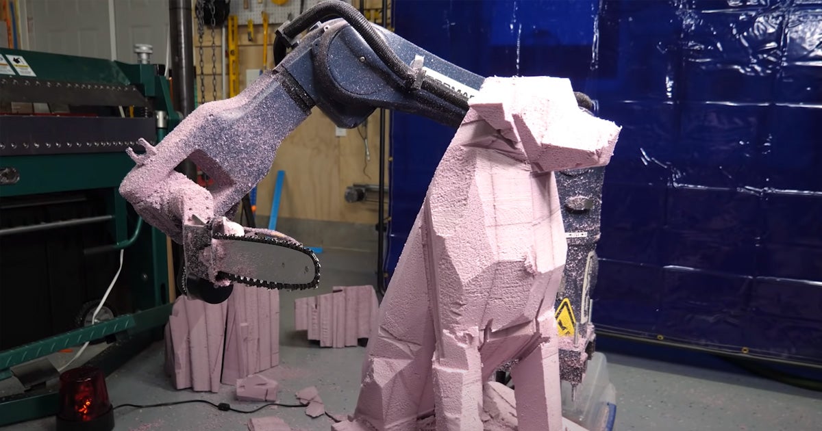 YouTube tinkerer Shane Wighton behind the channel Stuff Made Here built a chainsaw-wielding robotic arm that can chisel a dog shape out of bits of foam.