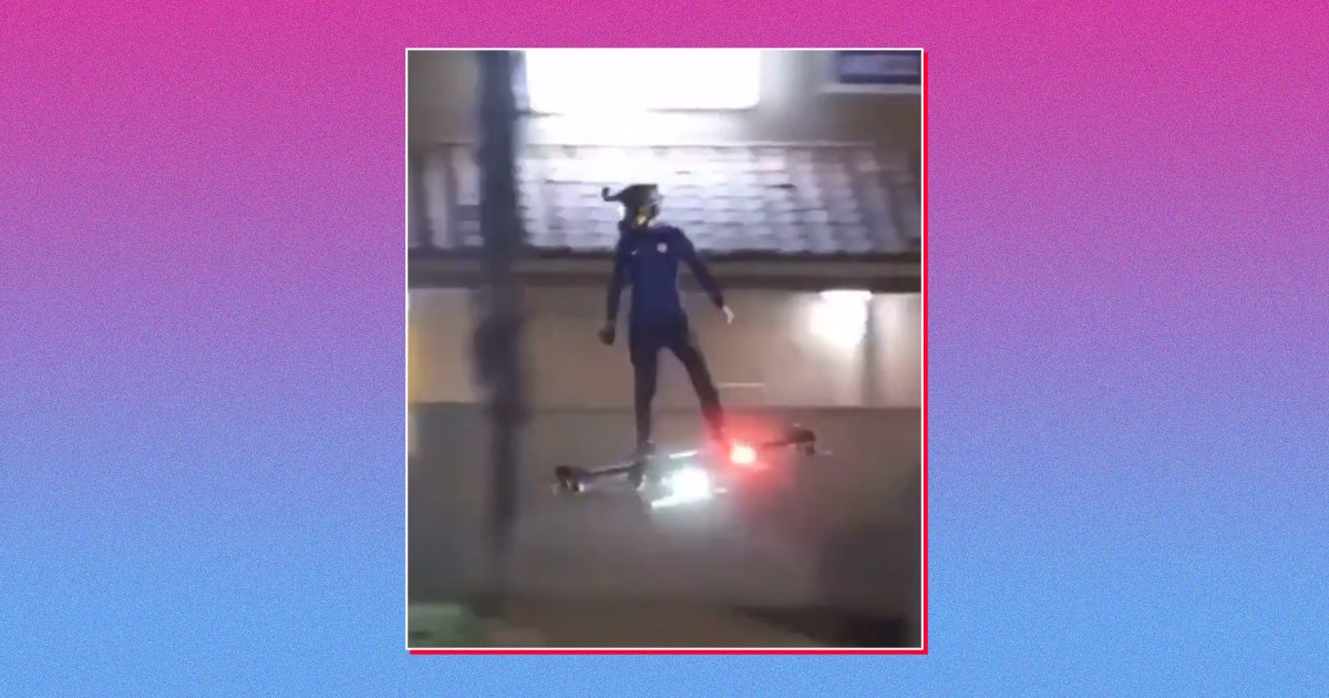 In a new viral video captioned "this man is living in 2030," a person can be seen zipping along a public road, riding on top of a high-powered drone.