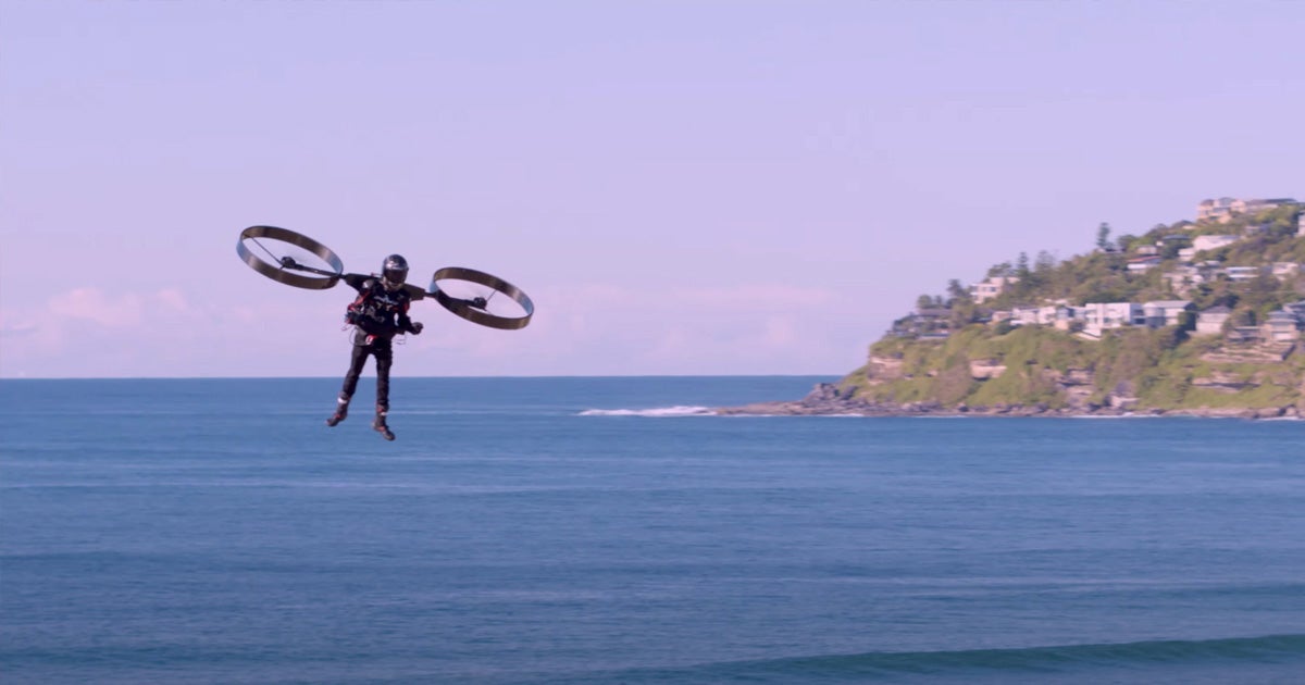 A new video shows off a daring pilot take off using what amounts to be a backpack helicopter — a futuristic blend of a jetpack and drone.