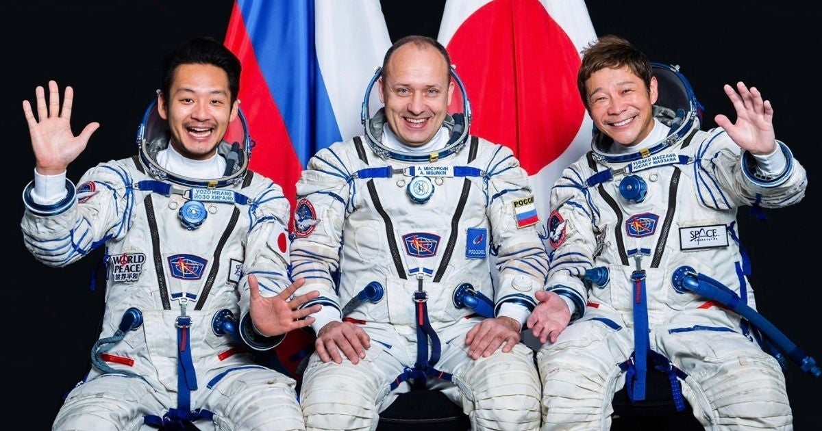 From right to left: Zozotown billionaire Yusaku Maezawa (R), Russian cosmonaut Alexander Misurkin (C), and Maezawa's assistant Yozo Hirano (L).