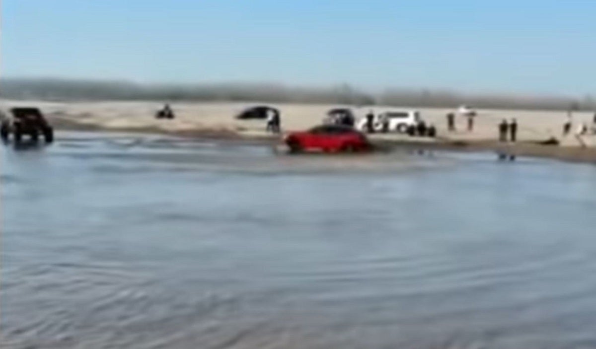 One brave Tesla owner took a red Model 3 off-road this week, posting a video of the car driving through what appears to be the ocean.