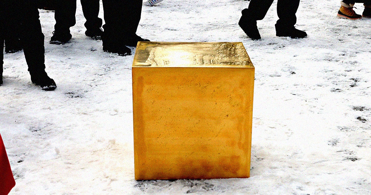 The tree-stump-sized gold cube worth a reported $11.7 million that graced Central Park's frozen lake is apparently promoting a cryptocurrency and NFTs.