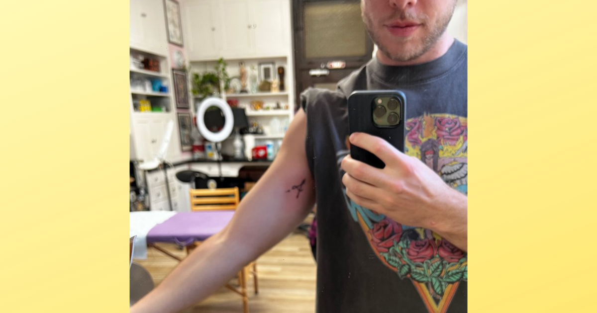 A guy got a tattoo created by OpenAI's DALL-E2 program, which creates realistic images and art from human language and AI machine learning.