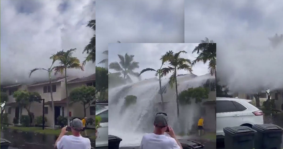 A shocking new video shows a massive tidal wave sweep over the top of a two-story condo in Keauhou, Hawaii, amid a "historic" ocean surf.