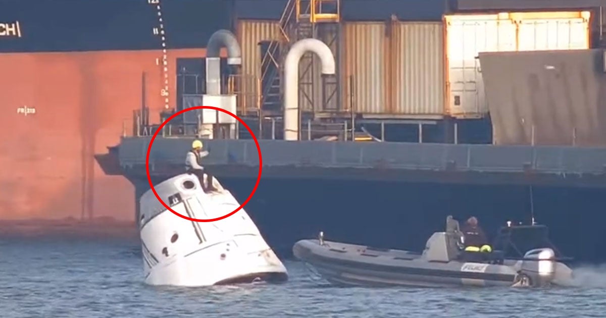 A man was spotted riding on top of what appears to be a SpaceX Dragon capsule bobbing in the water while being towed off the coast of Port Canaveral.