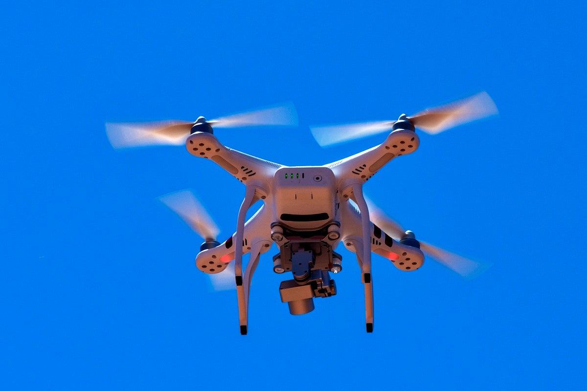 An Australian woman has pleaded guilty after being caught flying a drone filled with contraband into a prison yard.