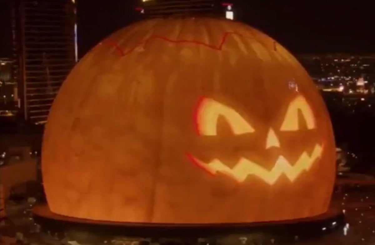 For Halloween, the gigantic sphere that now dominates the Las Vegas skyline is done up as a jack-o'-lantern.