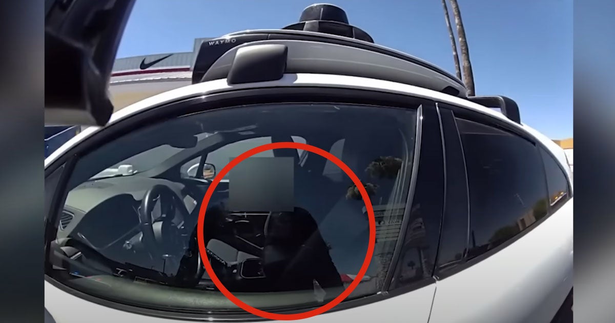 A video shows a police officer in Phoenix, Arizona pulling over a self-driving vehicle after it drove down a busy road in the opposing lane.
